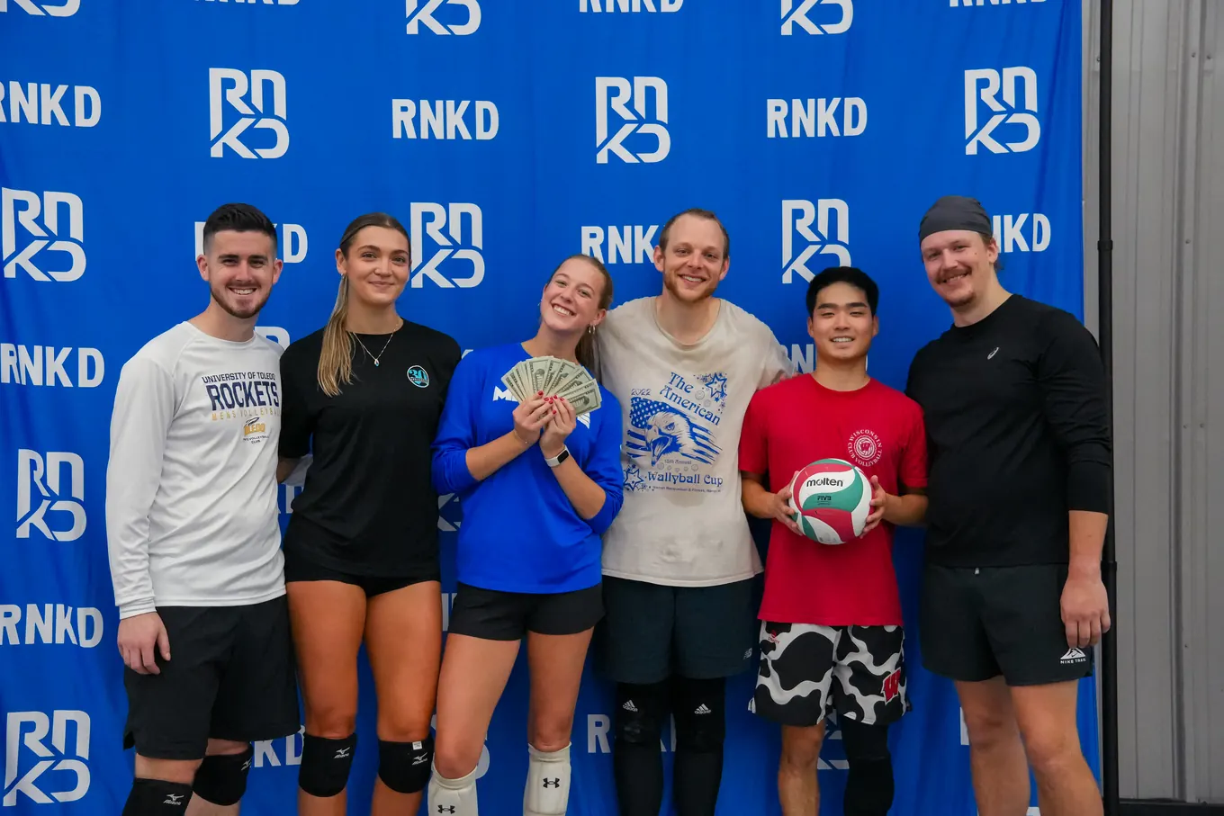 Potential Losers, the RNKD Coed 6s runners-up, with their cash prize in front of the RNKD backdrop